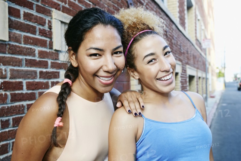 Hispanic women smiling in city