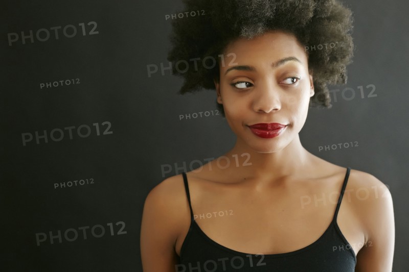 Close up of black woman smirking