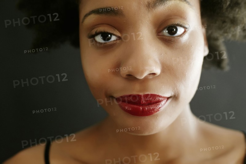 Close up of black woman smirking