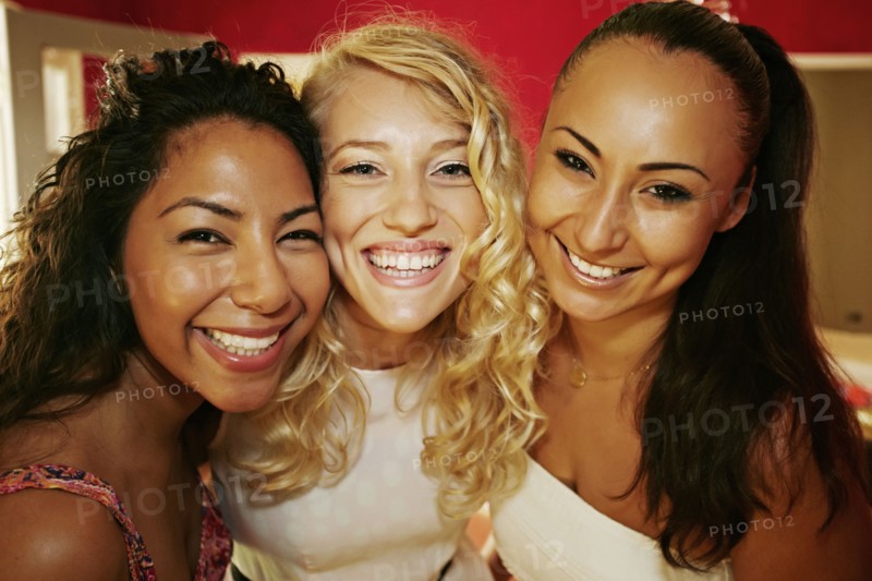 Close up of women smiling together