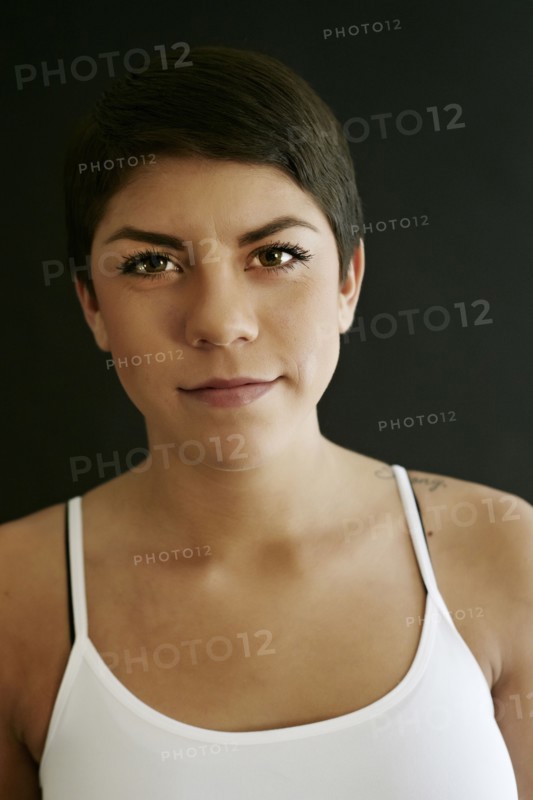Close up of Hispanic woman with serious expression