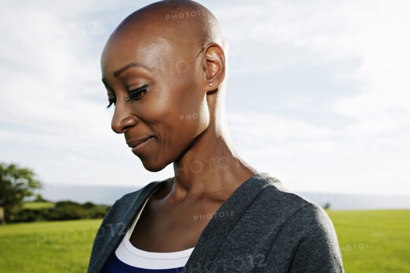 African American woman smiling in park