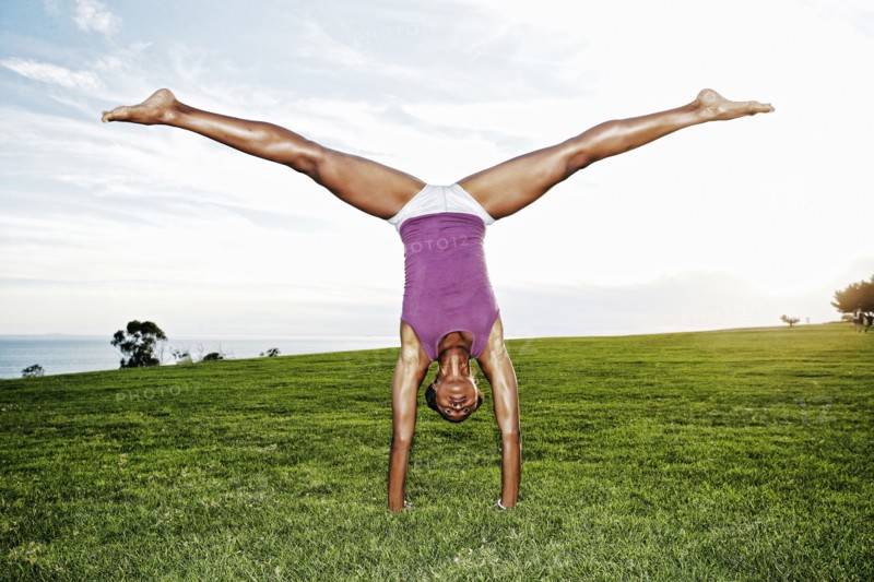 African American woman practicing yoga in park