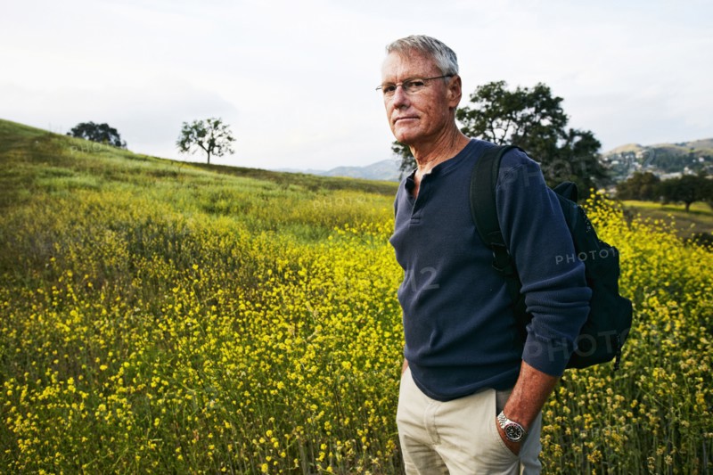 Caucasian man standing in tall grass