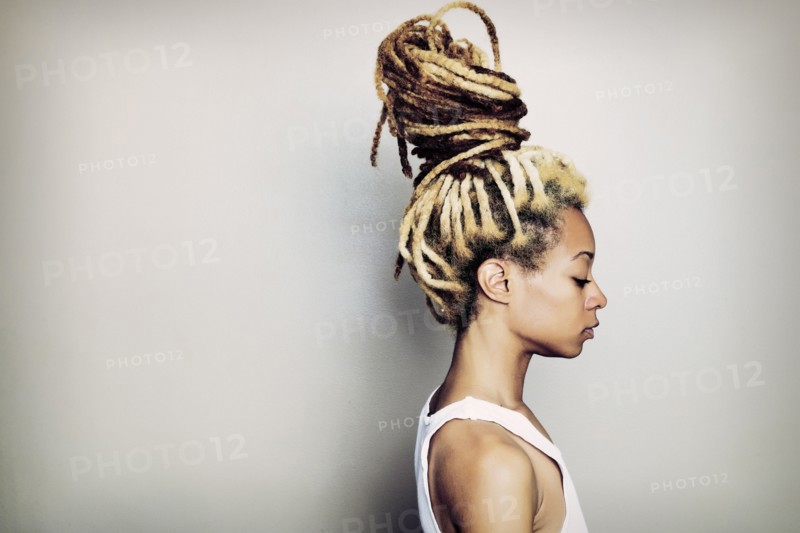 Black woman with dreadlocks bun