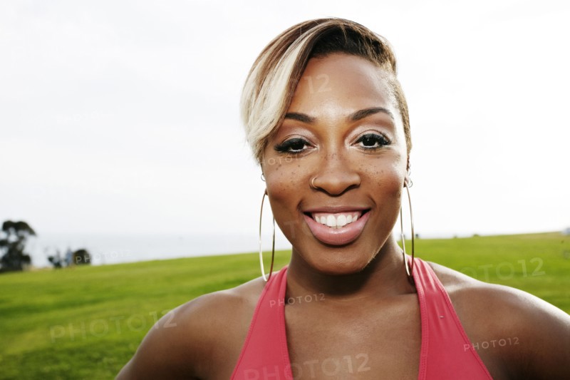 Black woman smiling in field