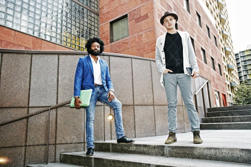 Businessmen standing on steps