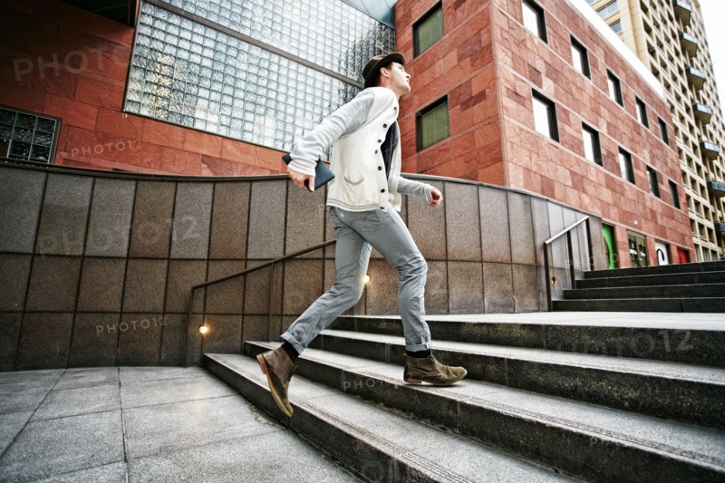 Caucasian businessman walking on steps