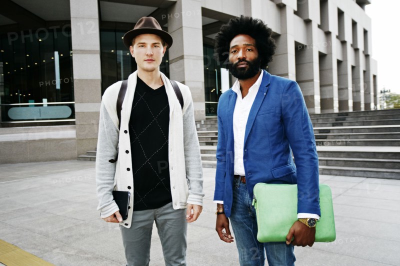 Businessmen standing in courtyard