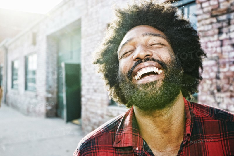 Mixed race man smiling outdoors