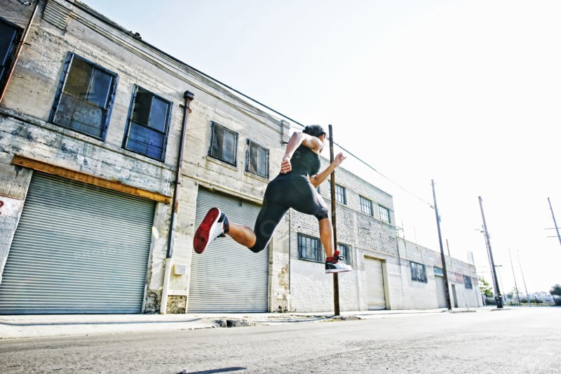 Mixed race woman running outdoors