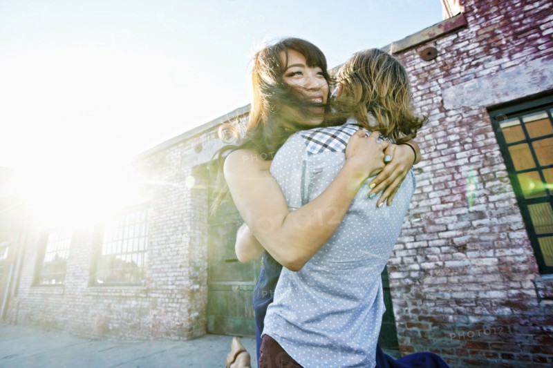 Couple hugging outdoors