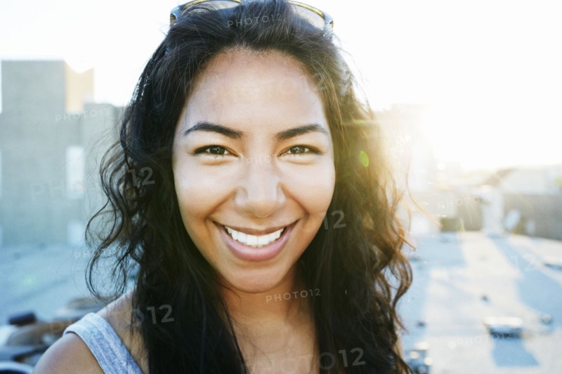 Hispanic woman smiling outdoors