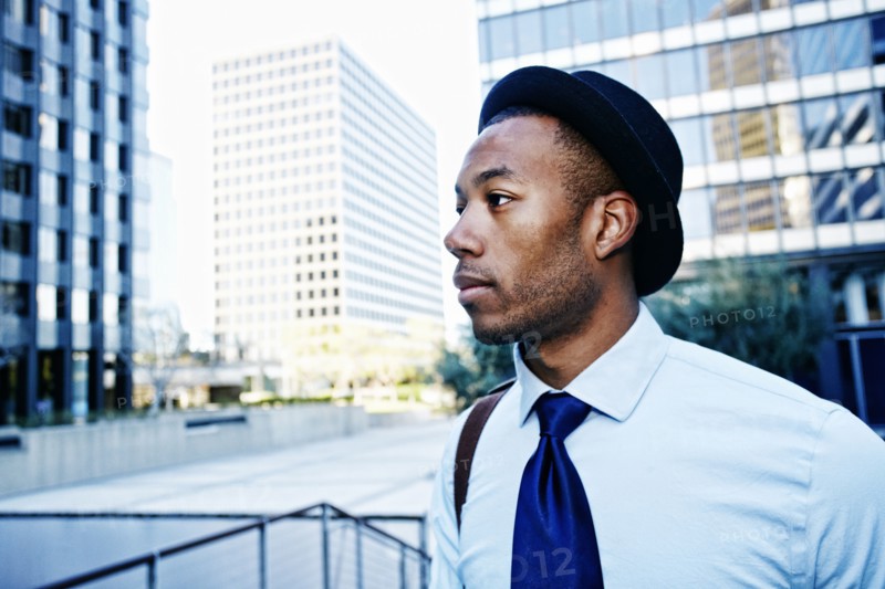Black businessman standing outside office building