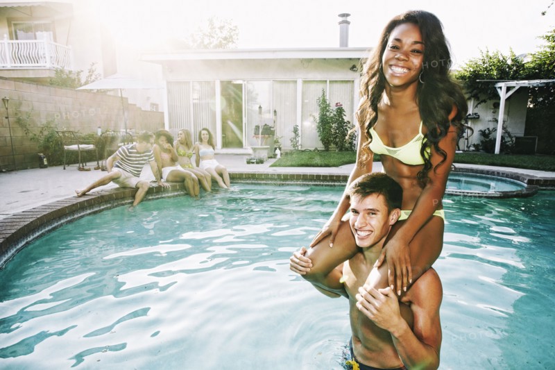 Couple playing in swimming pool