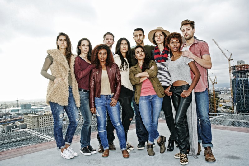 Stylish friends posing on urban rooftop