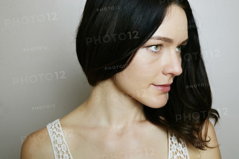 Caucasian woman near wall