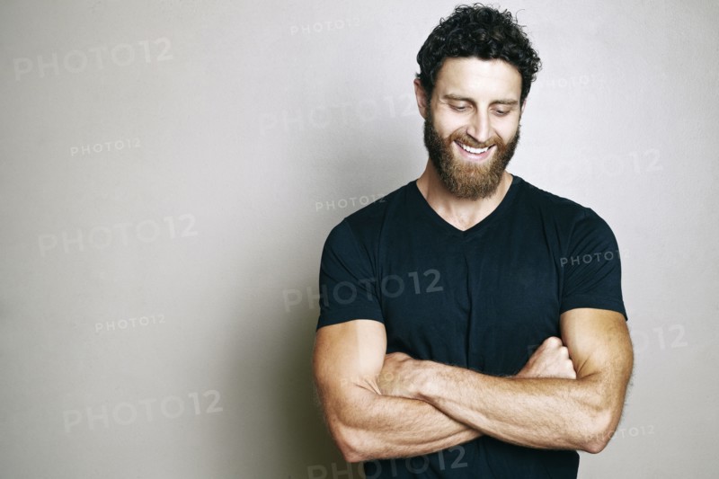 Smiling Caucasian man with beard looking down