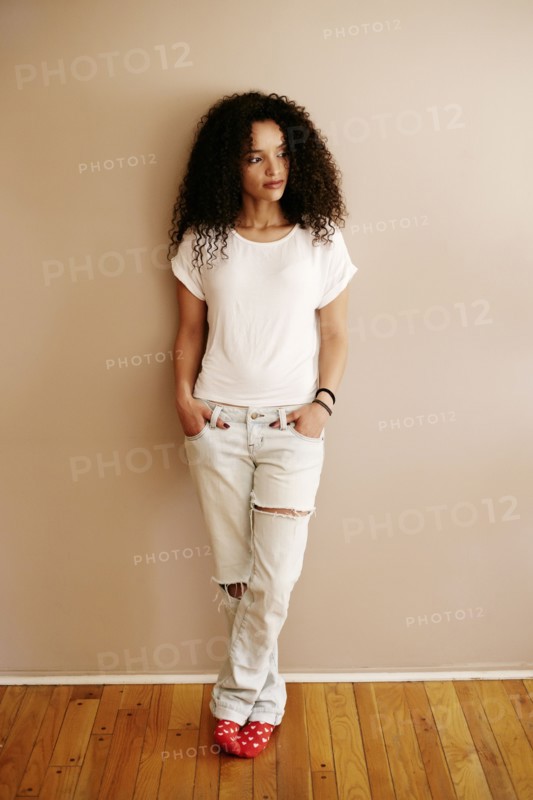Pensive Hispanic woman looking away