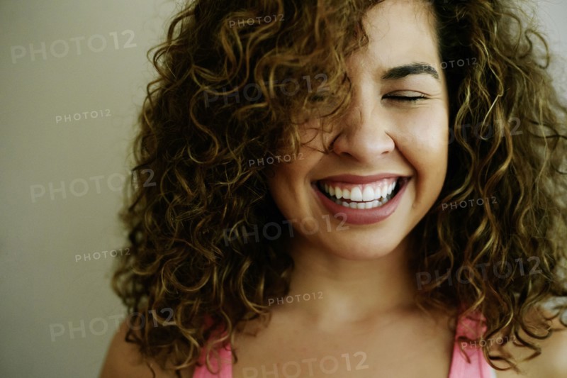 Portrait of laughing Mixed Race woman