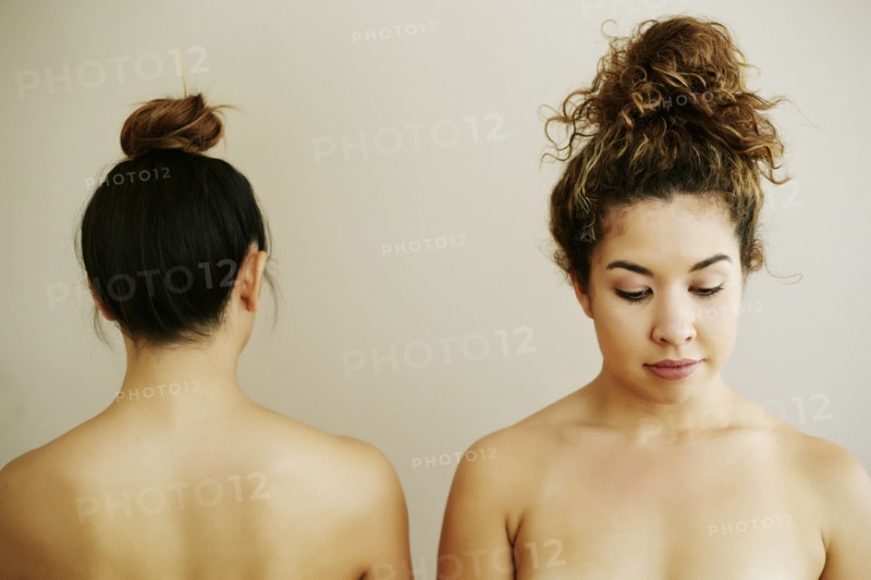 Front and rear view of shoulders of naked women