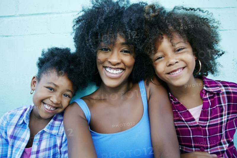 Portrait of smiling mother and daughters