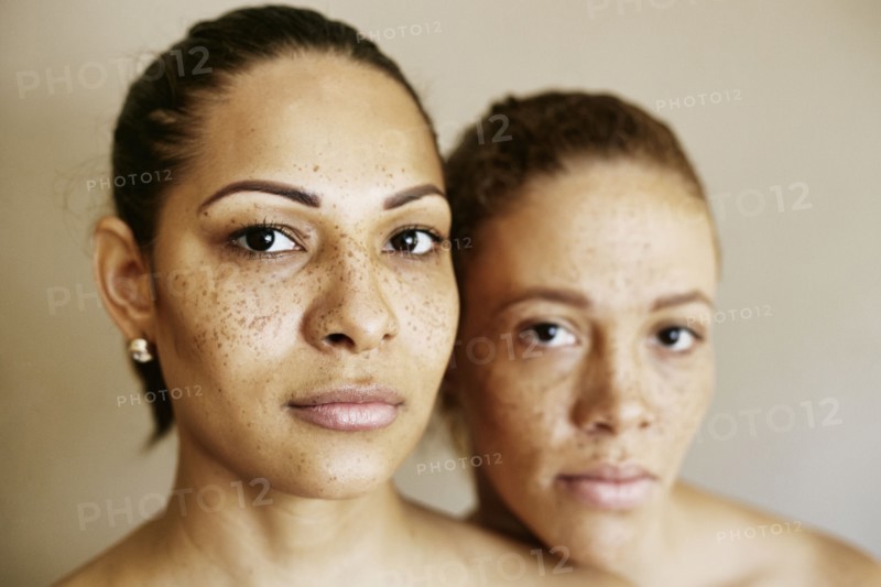 Close up of serious mixed race women