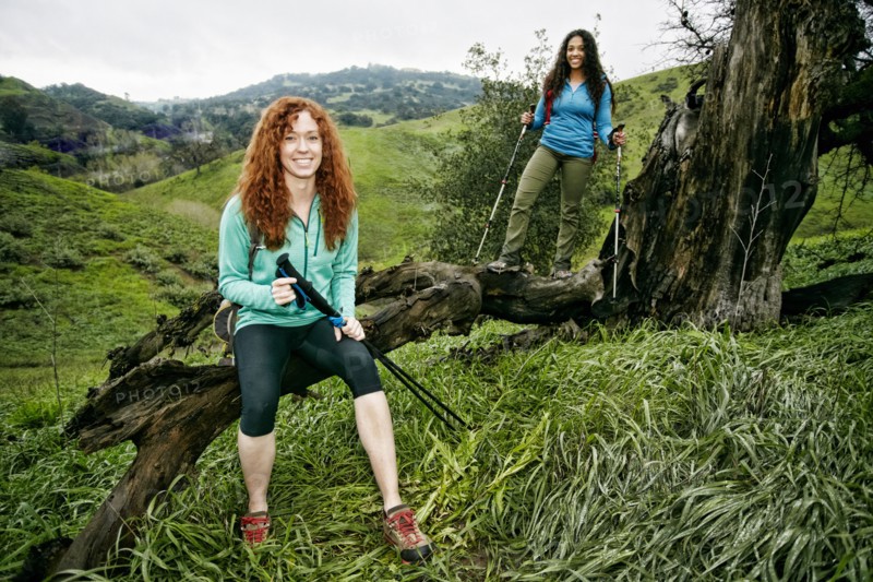 Portrait of hikers holding walking sticks