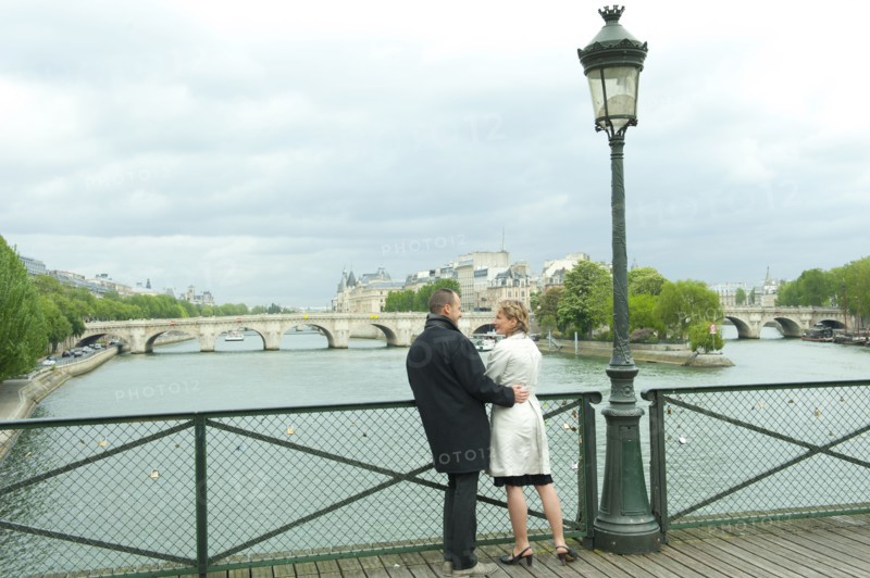 Caucasian couple talking on bridge
