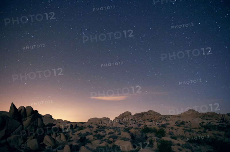 Stars in sky over desert