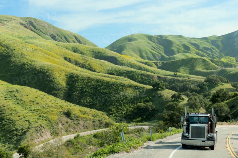 Semi-truck driving on remote highway