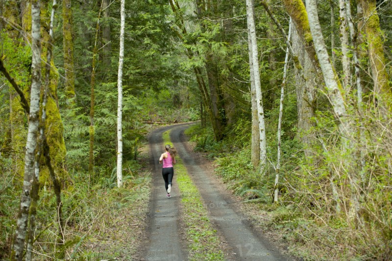 Mixed race runner training on remote road