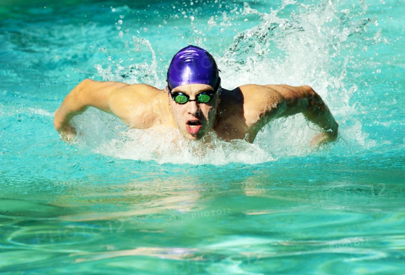 Caucasian swimmer training in swimming pool