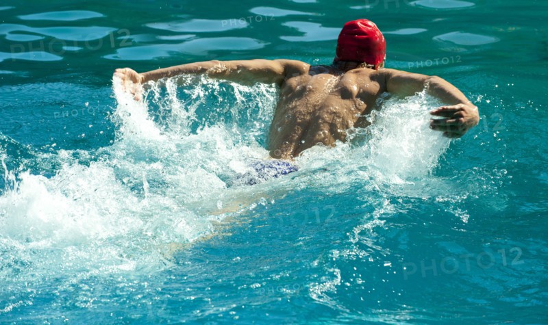 Caucasian swimmer training in swimming pool