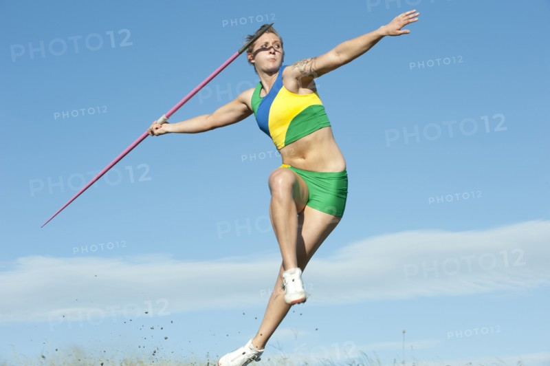Caucasian athlete throwing javelin