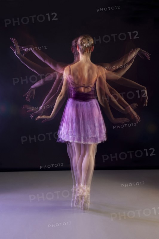 Caucasian ballerina dancing on stage