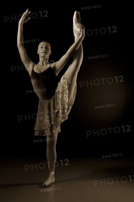 Caucasian ballerina dancing on stage