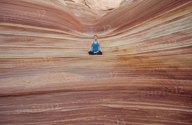 Caucasian woman practicing yoga outdoors