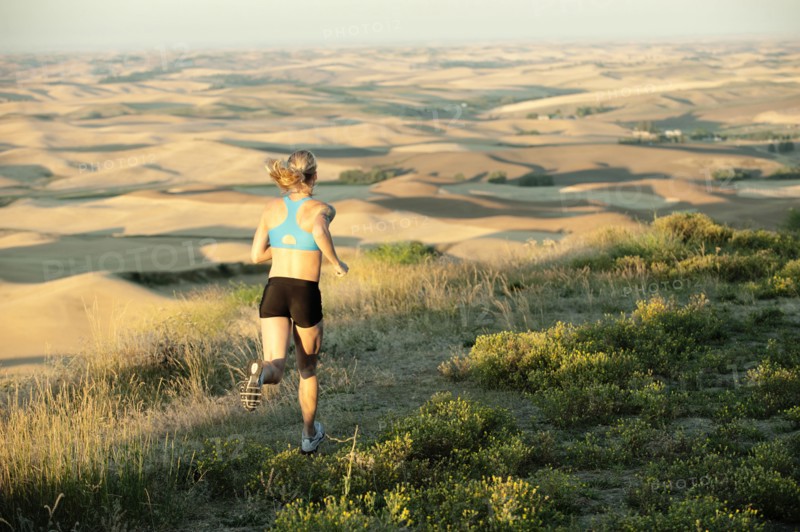 Caucasian woman running in remote area