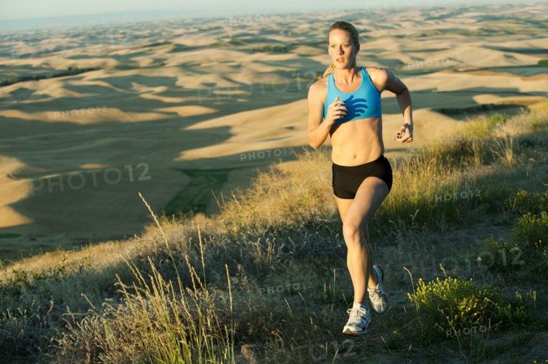Caucasian woman running in remote area