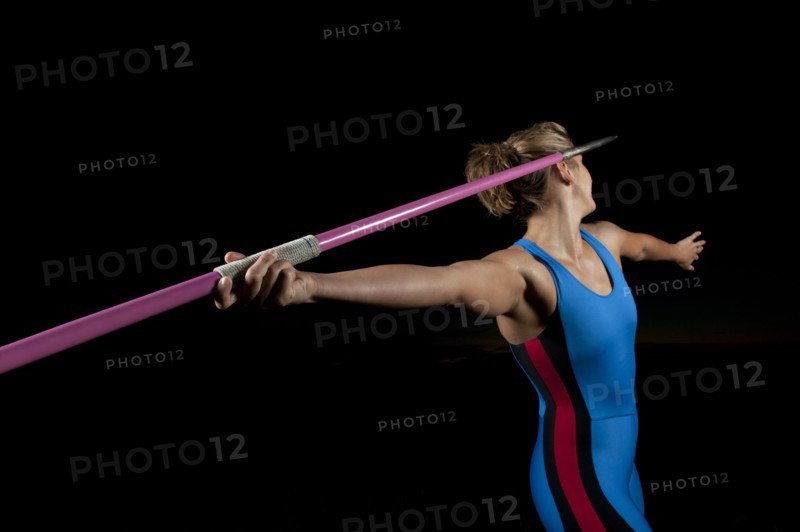 Caucasian athlete aiming javelin