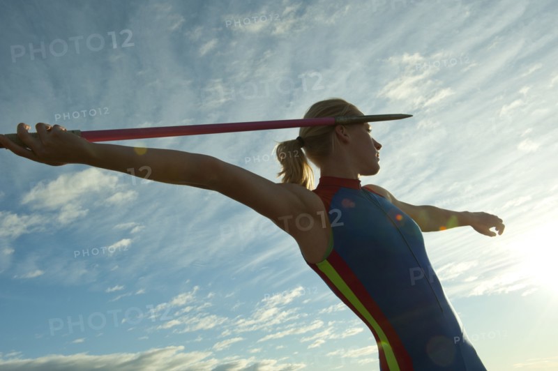 Caucasian athlete aiming javelin