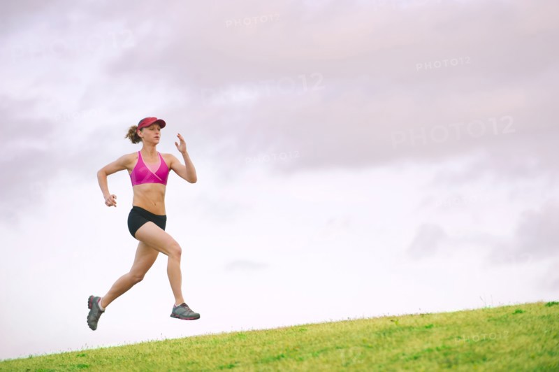 Caucasian woman running in park