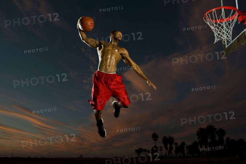 Black man playing basketball