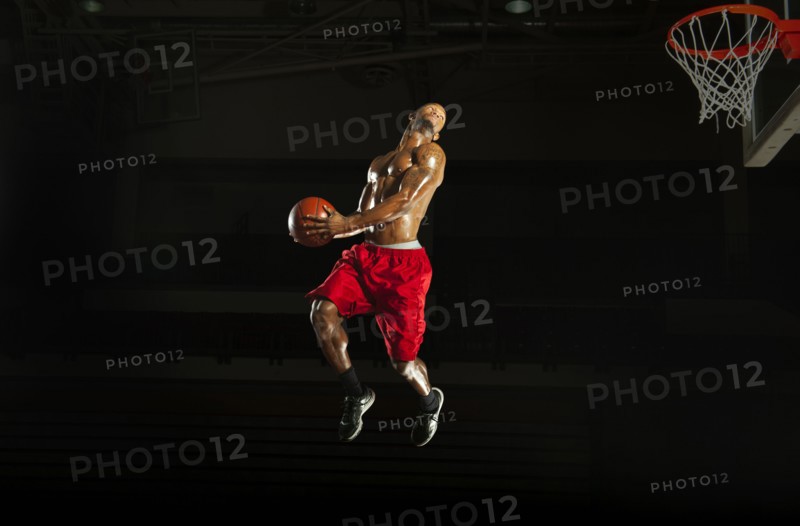 Black man playing basketball