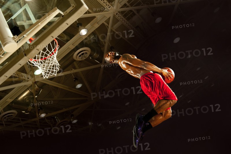 Black man playing basketball