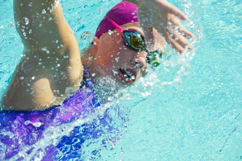 Caucasian woman swimming