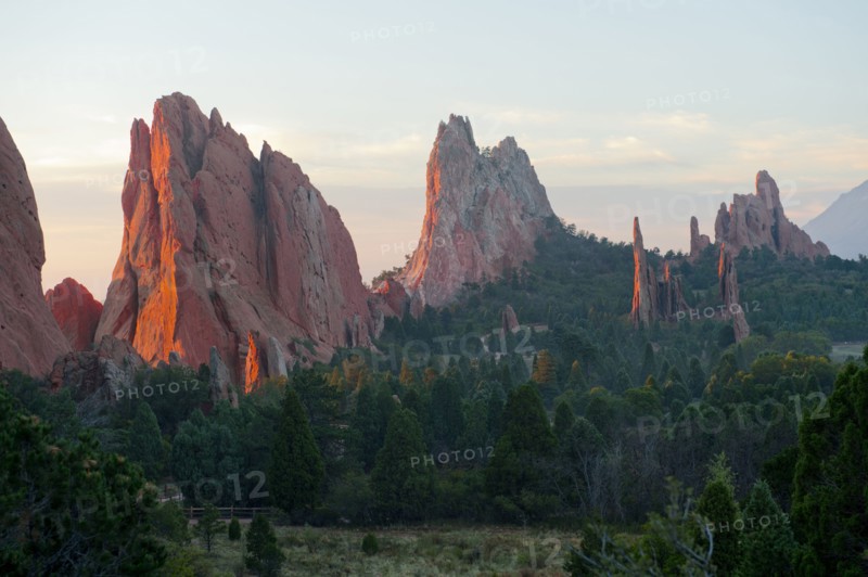 Red cliffs rising in rural landscape