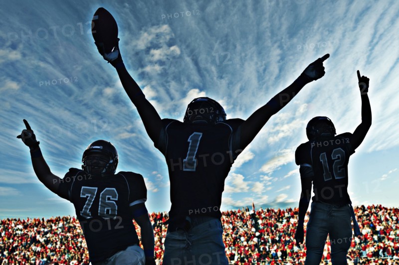 Football players cheering in game