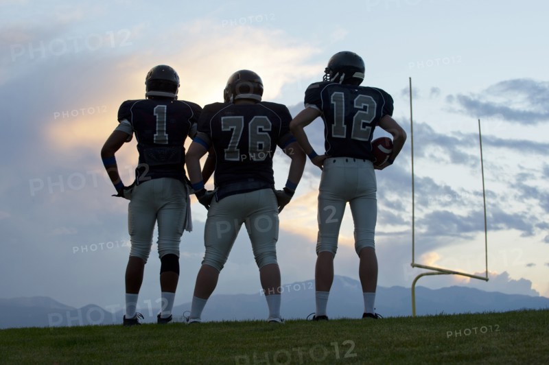 Football players standing on field